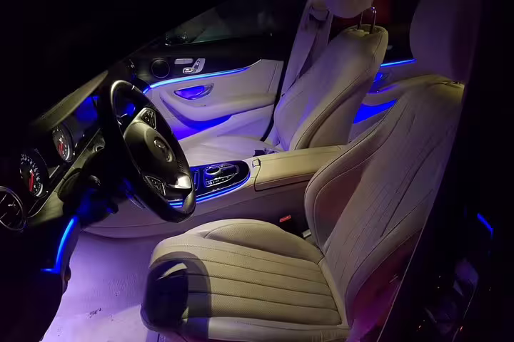 Luxury Mercedes interior with blue ambient lighting for private transfer from Valencia Airport VLC to Valencia