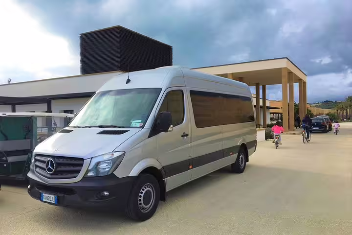 Modern Mercedes minivan waiting outside a hotel for a private transfer between Palermo airport and Hotel Porta Felice