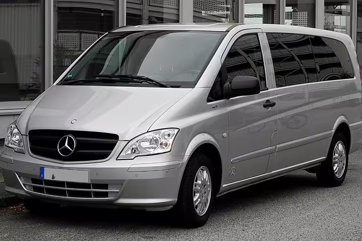 Modern silver Mercedes minivan used for private transfer service from Positano to Rome, offering comfortable door to door travel.