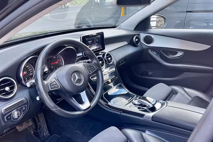 Modern interior of a Mercedes vehicle offering comfort for private transfer from Naples to Sorrento or Positano.