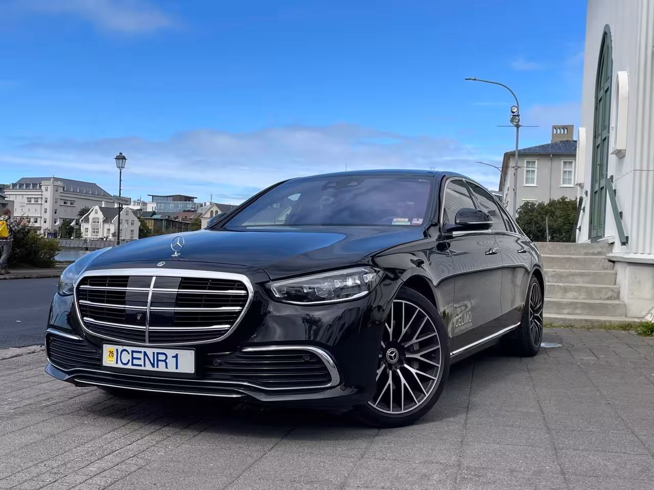 Black Mercedes S-Class luxury sedan with ICENR1 plate parked in Reykjavik for private airport transfer