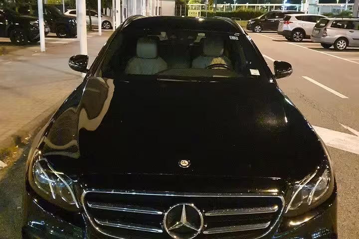 Sleek black Mercedes-Benz sedan ready for private transfer from Amsterdam Cruise Port to The Hague