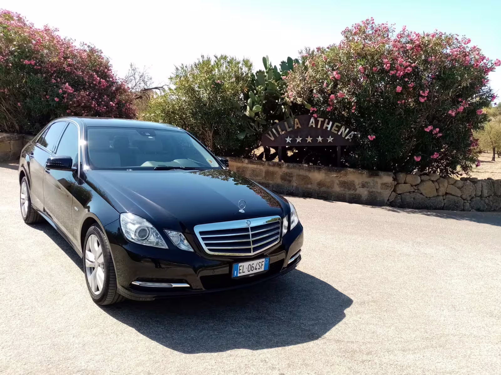 Elegant black Mercedes sedan providing premium private transfer service for Monreale and Mondello day trip from Palermo