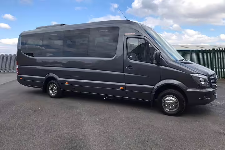Dark grey Mercedes Sprinter luxury minibus for private transfer service