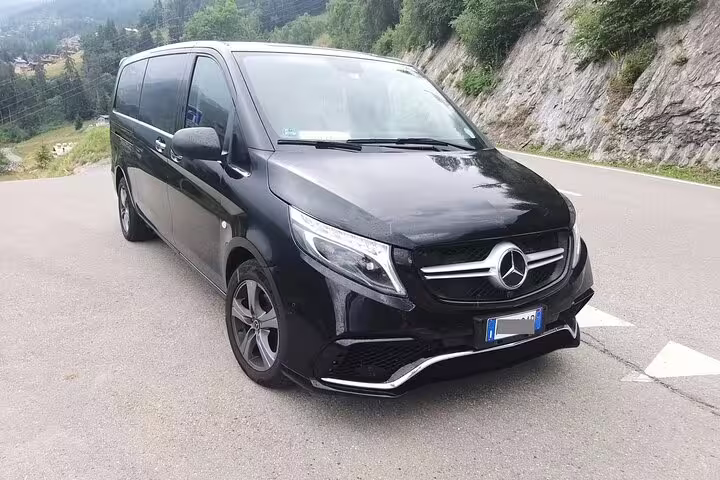 Luxury black Mercedes V-Class minivan offering private transfer service from Amsterdam Cruise Port to The Hague