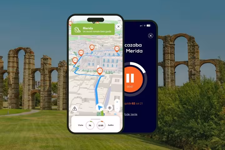 Merida self-guided walking tour app showing 3D map with audio stops and Roman aqueduct in background