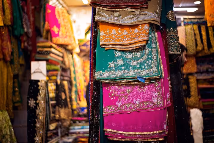 Colorful embroidered textiles in a local bazaar, cultural shopping stop on a 10-day Mesopotamia tour