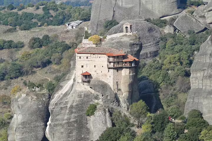 Meteora cliff monastery perched on towering sandstone rock, scenic stop on Delphi and Meteora 2-day tour