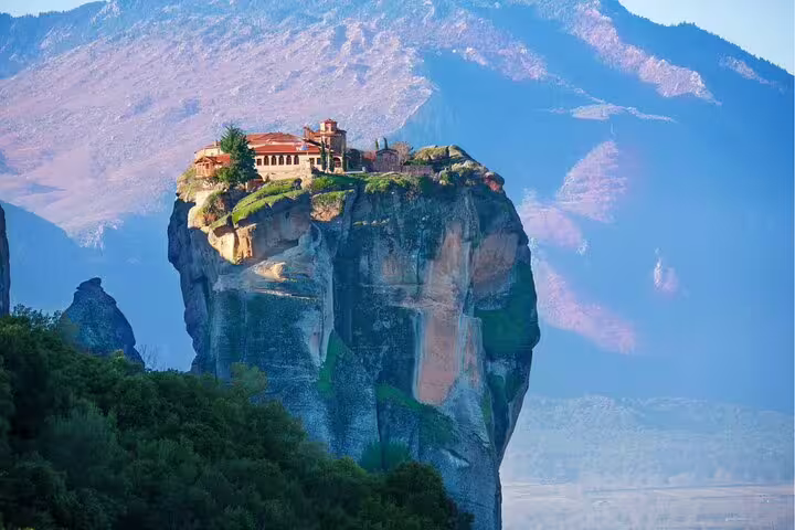 Meteora monastery perched on towering rock pillar, highlight of full-day private tour from Athens with lunch