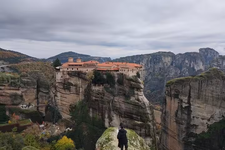 Meteora monastery perched on towering cliffs, panoramic view on a 2-day luxury private tour from Athens