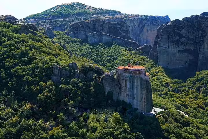 Meteora monastery perched on towering cliffs, scenic stop on Thessaloniki to Meteora private day trip