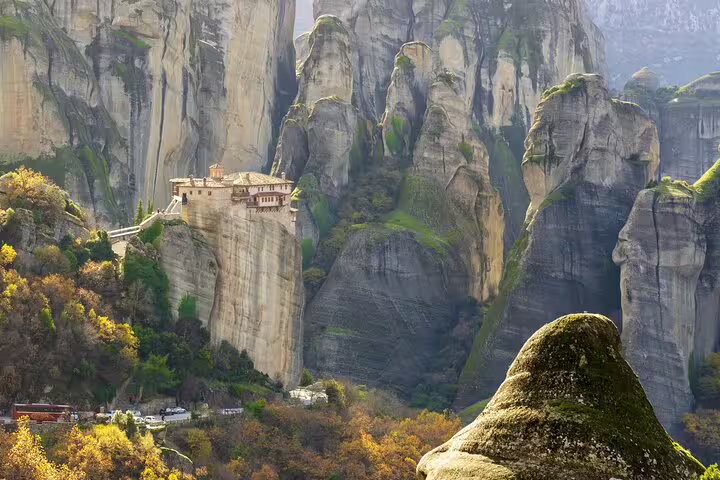 Cliffside Meteora monastery amid dramatic sandstone spires, scenic viewpoint on a full-day private tour