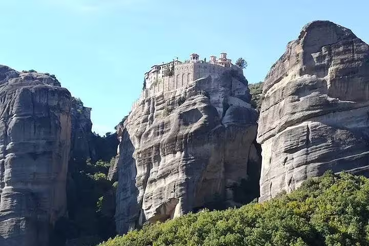 Meteora cliff-top monastery view, scenic stop on a 2-day private Greece tour from Athens to Delphi and Olympia