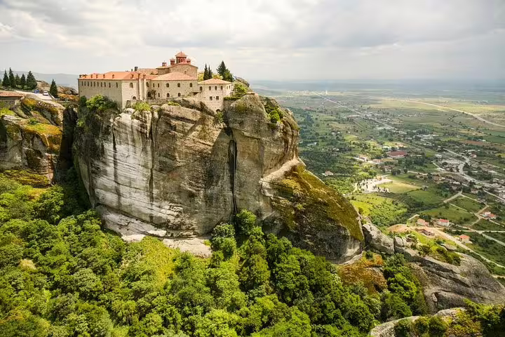Aerial view of Meteora cliff-top monastery in Kalabaka, Greece, ideal stop on private transfer to Athens