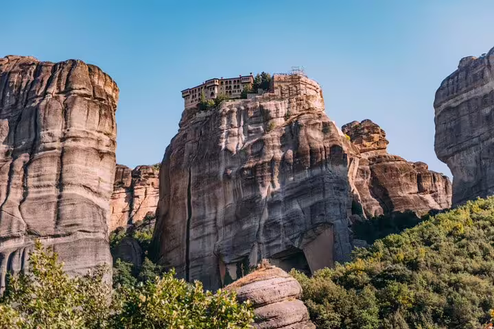 Panoramic view of Meteora monastery crowning massive rock formations, private day tour from Athens Greece