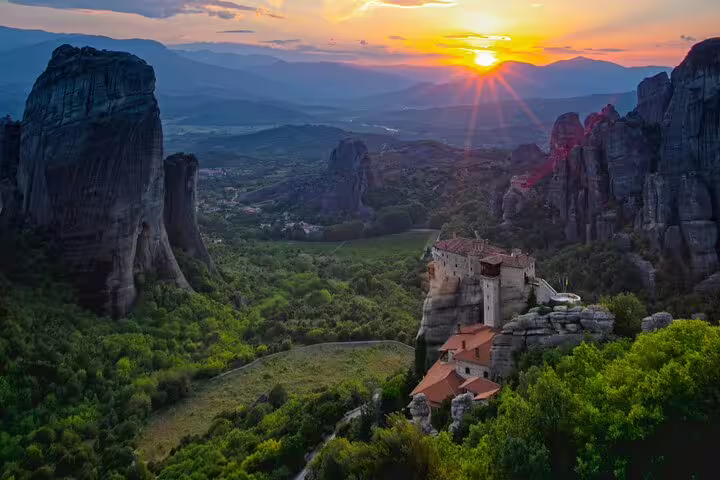 Meteora monastery atop towering rock pillar, scenic landscape view on full-day private tour in Greece