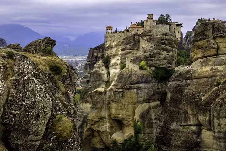 Meteora monastery perched on towering sandstone cliffs, scenic viewpoint on a full-day private tour in Greece