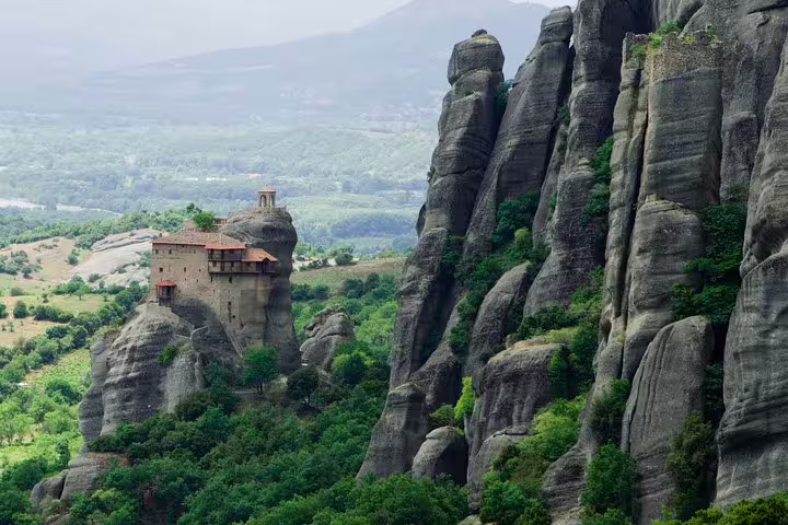 Monastery perched on Meteora sandstone pillars, iconic sight on Athens to Meteora full-day private tour