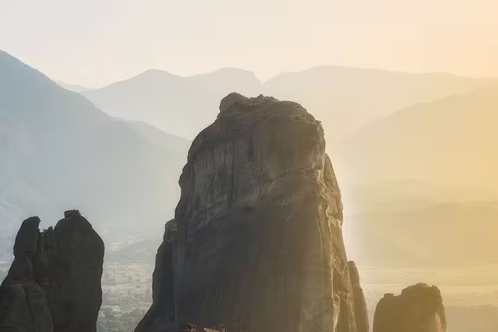 Sunrise glow on a towering Meteora rock formation, scenic highlight on a private full-day Meteora tour