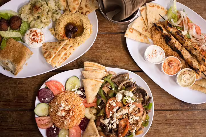 Greek mezze lunch with pita, hummus and grilled skewers, perfect stop on a Meteora full-day private tour
