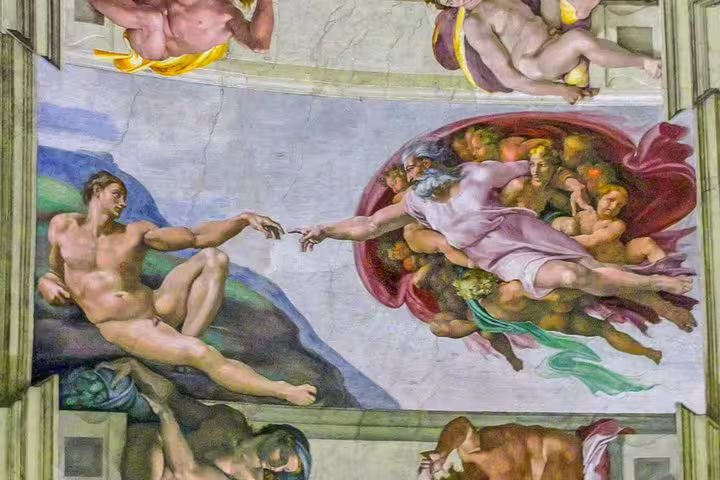 Michelangelo’s Creation of Adam fresco on the Sistine Chapel ceiling, seen on a private VIP Vatican Museums tour in Rome