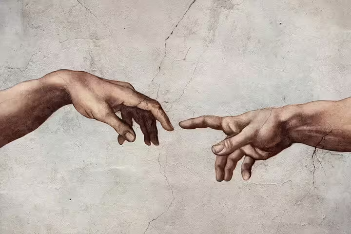 Detail of Michelangelo’s Creation of Adam in the Sistine Chapel, showcased on a Vatican Museum private family guided tour