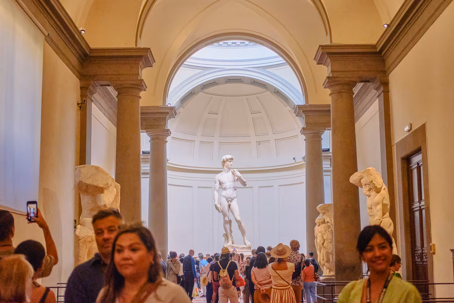 Visitors admire Michelangelo's David at the Accademia Gallery on a skip-the-line guided tour in Florence.