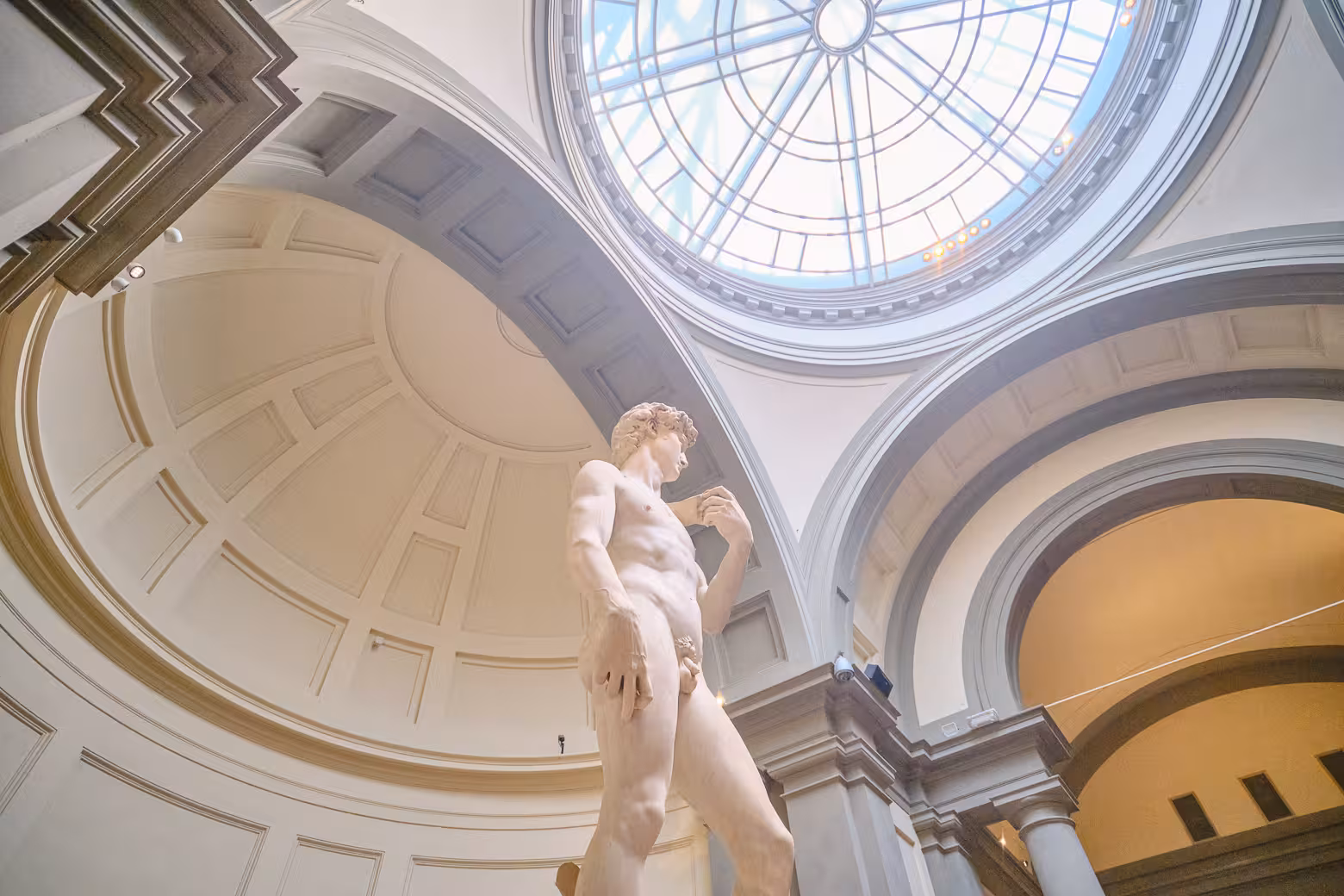 Michelangelo's David under the iconic dome in Accademia Gallery Florence, featured in a skip-the-line guided tour.