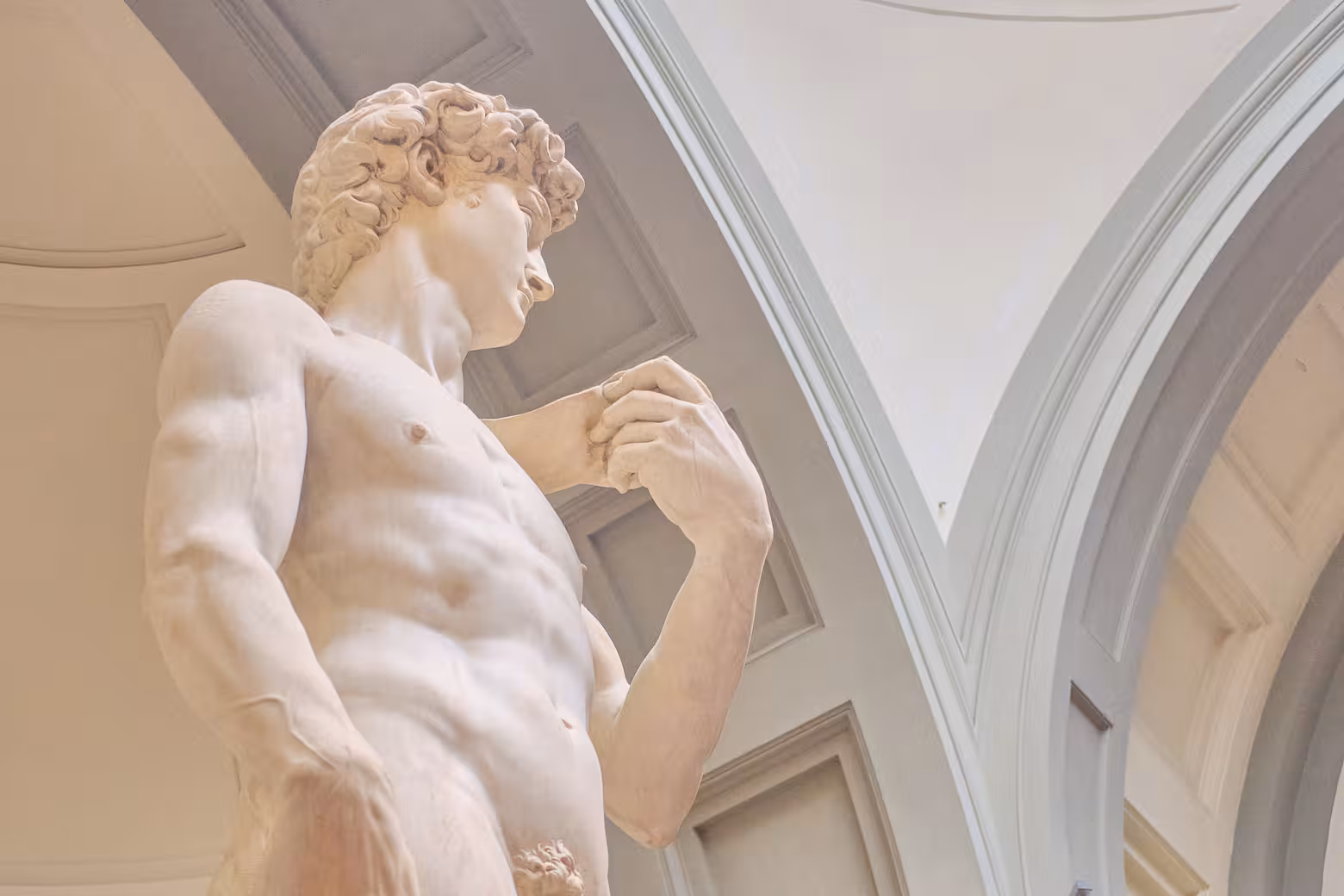 Close-up of Michelangelo's David statue in the Accademia Gallery, Florence, highlighting Renaissance artistry.