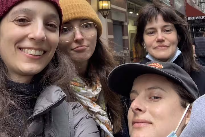 Four women taking a selfie on a Midtown NYC street during a walking tour