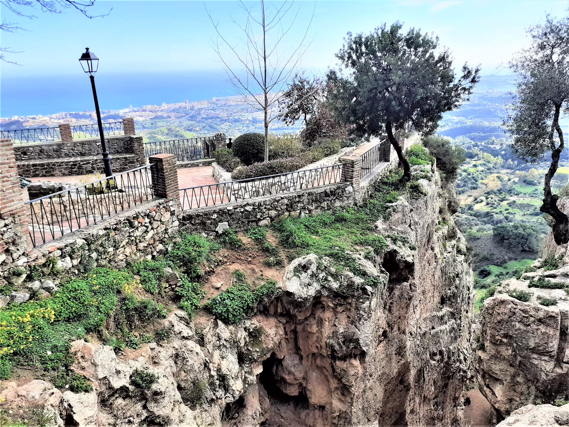 Clifftop viewpoint in Mijas Pueblo with stone railings and sweeping Costa del Sol sea views on walking tour