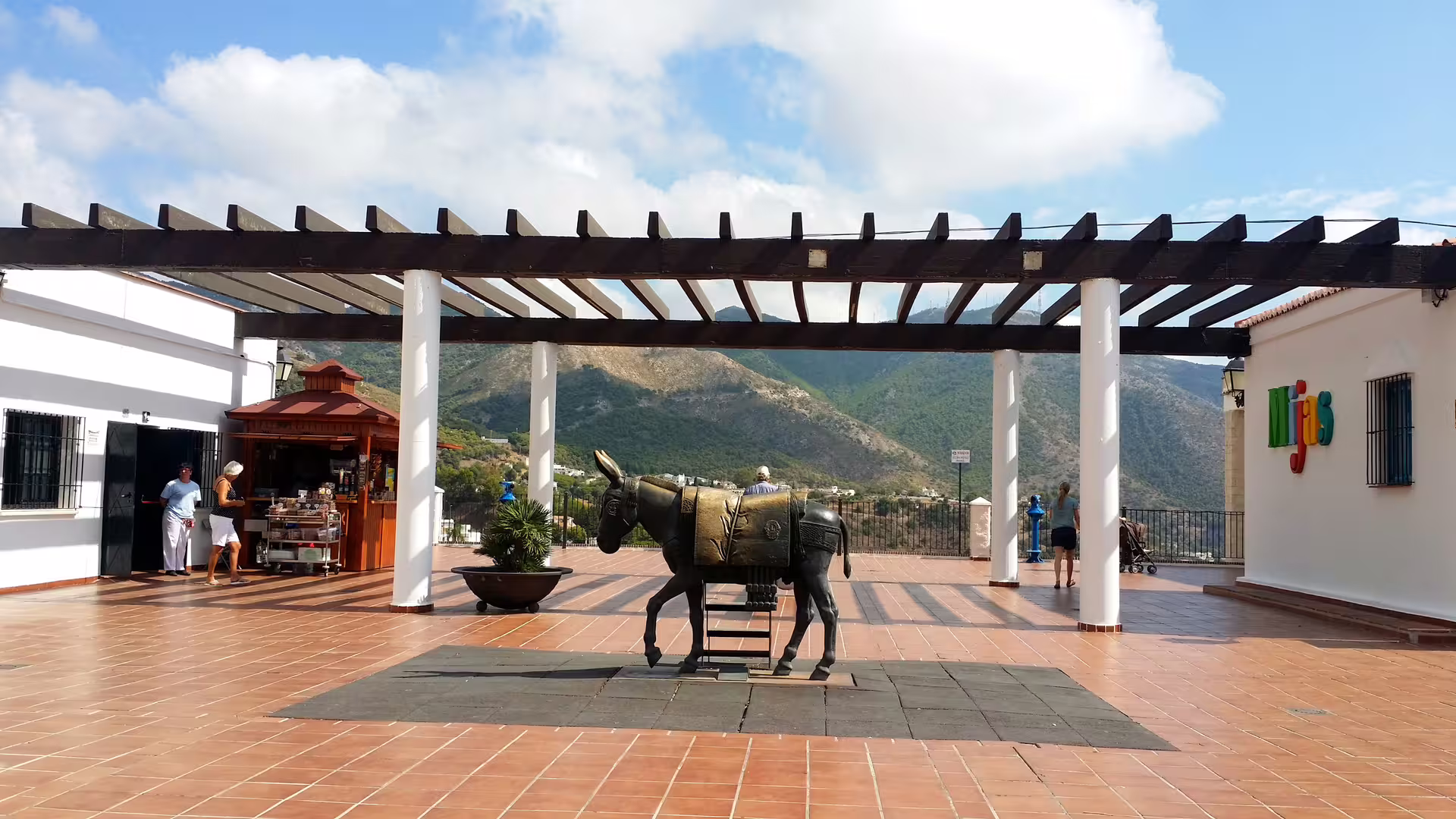 Mijas Pueblo viewpoint terrace with donkey statue and mountain views on private Malaga and Mijas day tour
