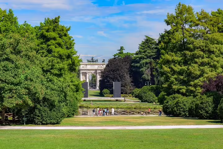 Scenic view of Milan's Arco della Pace surrounded by lush greenery, perfect for a private sightseeing tour.