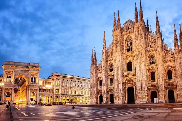 Stunning view of Milan Cathedral at dusk, showcasing the city's iconic architecture for travelers arriving via private transfer.