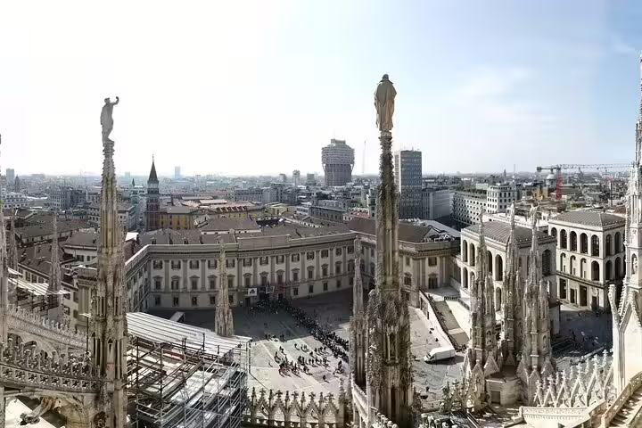 Panoramic view of Milan's historic architecture from the Duomo rooftop, featured in a customizable half-day tour to Varese.