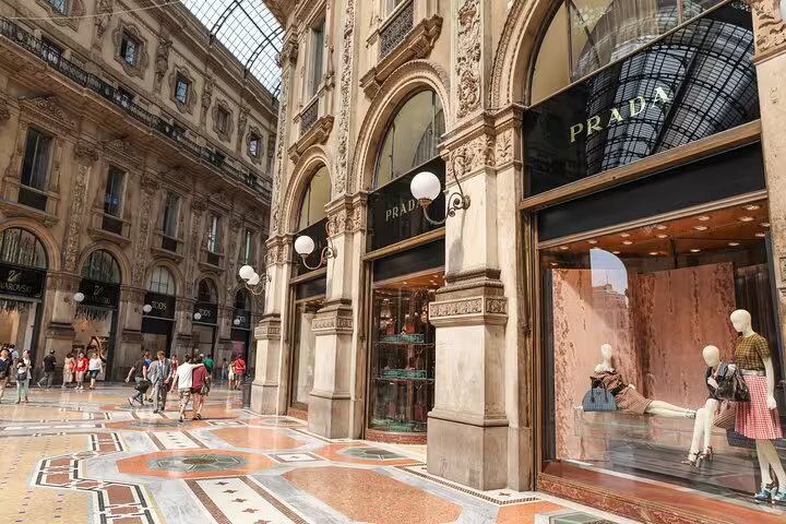 Prada luxury boutique inside Galleria Vittorio Emanuele II Milan with ornate architecture and marble floors