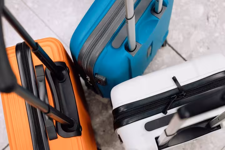 Colorful suitcases ready for Milan Central Station luggage storage, secure baggage deposit for train travelers