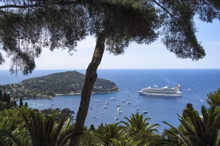 Scenic coastal view of Nice with cruise ships and yachts, highlighting the allure of a Milan to Nice transfer.