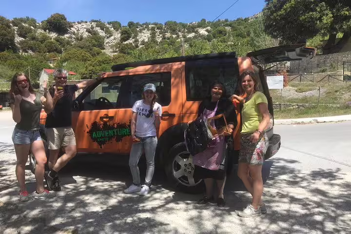Group of tourists enjoying an adventurous day trip with Adventure Tours, ready for the Milatos Cave exploration.