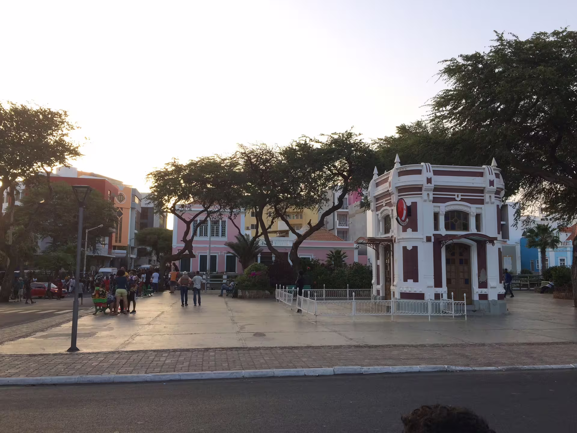 Charming view of Mindelo's colorful colonial architecture and vibrant street life on a sunny day during the São Vicente shore excursion.