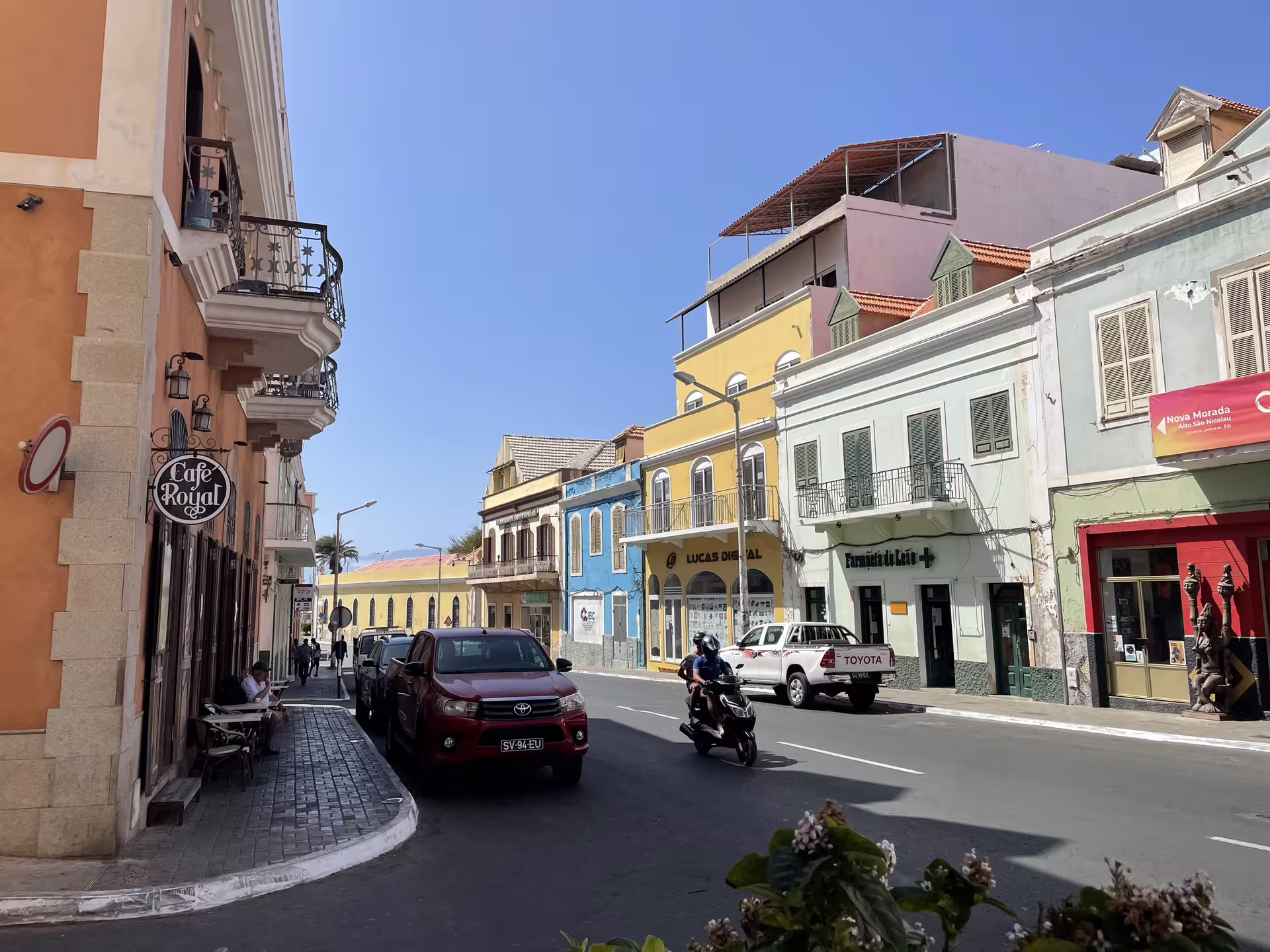 Colorful colonial buildings line a vibrant street in Mindelo, São Vicente, capturing the charm of Cape Verde's culture.