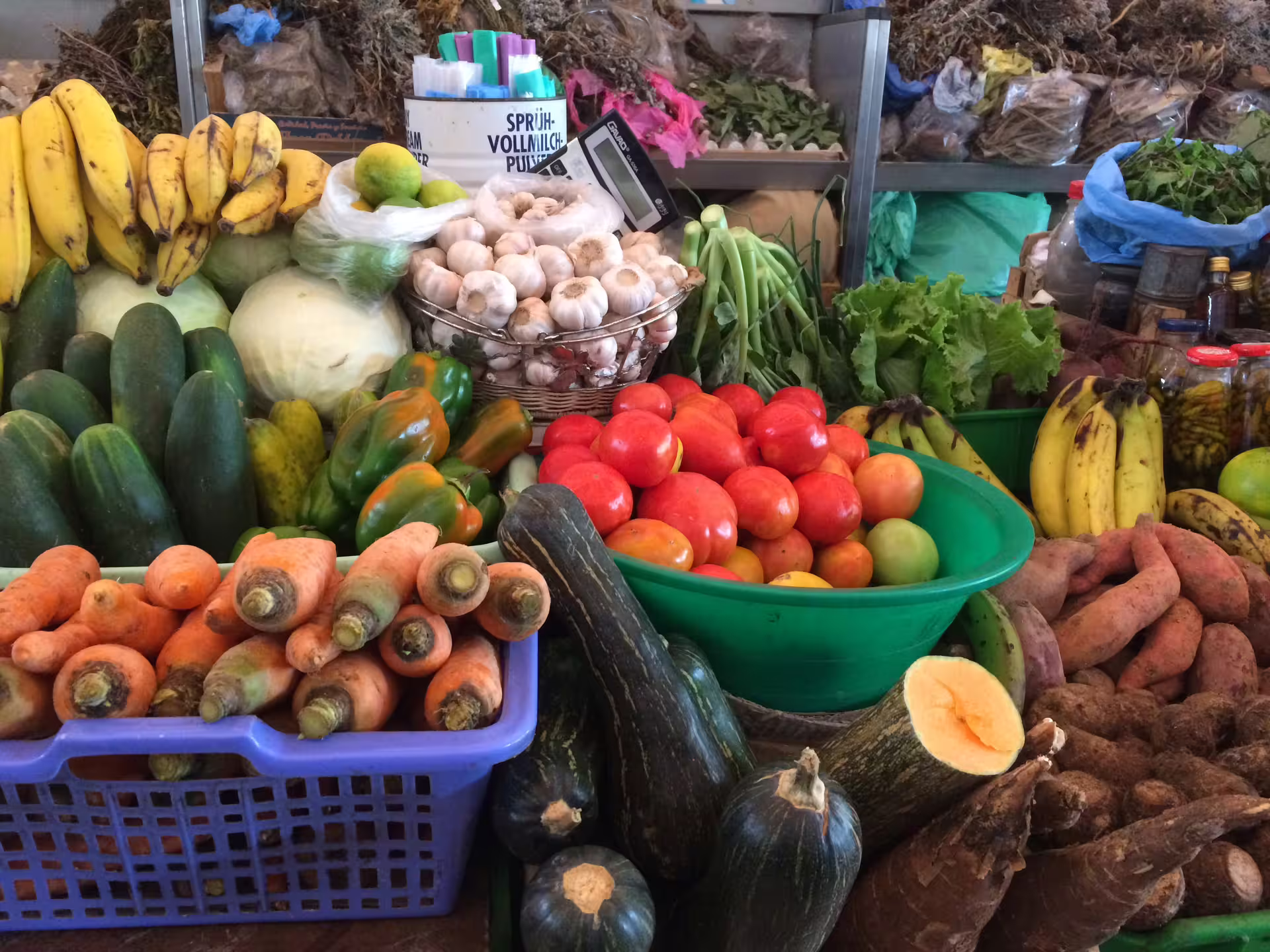 Vibrant local produce at a bustling market in Mindelo, showcasing fresh fruits and vegetables on a city walking tour.