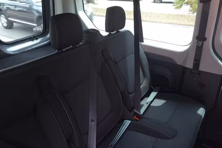 Rear bench seating with seatbelts in modern minivan for private Marseille to Lyon airport transfer