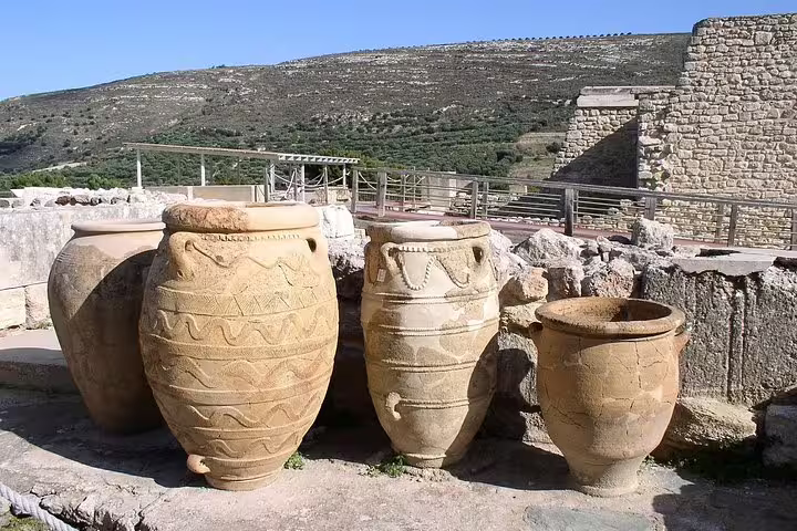 Large Minoan storage jars at the Palace of Knossos, key highlight of a private full-day tour from Heraklion