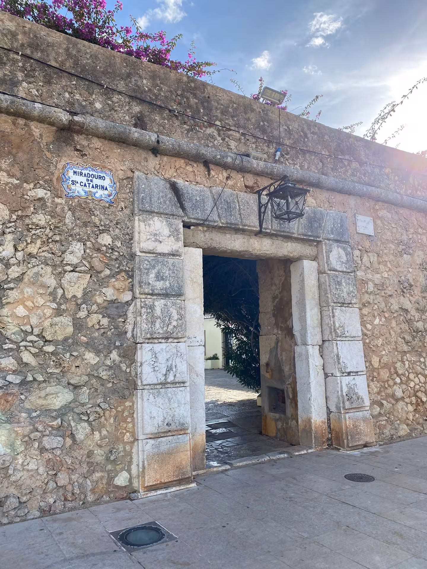 Stone gateway of Miradouro de Santa Catarina in Portimão, opening to historic streets on the Arade River viewpoint route