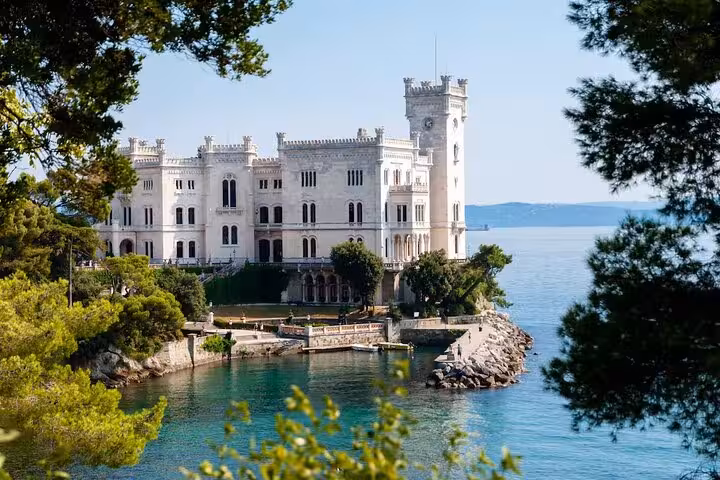 Majestic Miramare Castle on the Adriatic coast, a scenic highlight for travelers heading to Trieste Port for cruises.