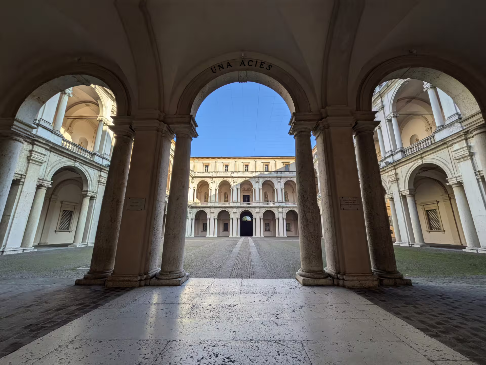 Elegant arches of Modena's historic architecture inviting exploration on the food and sightseeing tour.