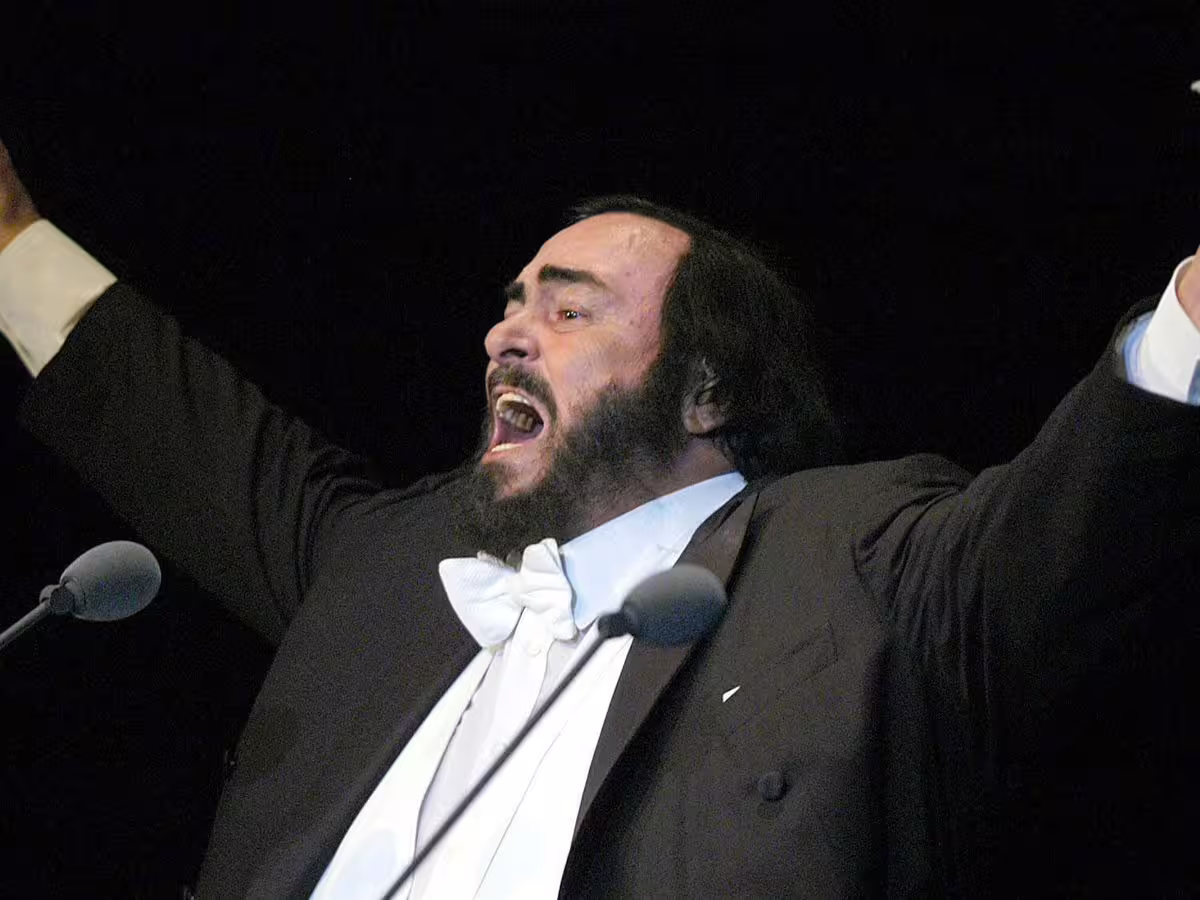 Opera singer performing on stage, highlight of Modena Museo Pavarotti visit in the combo ticket tour