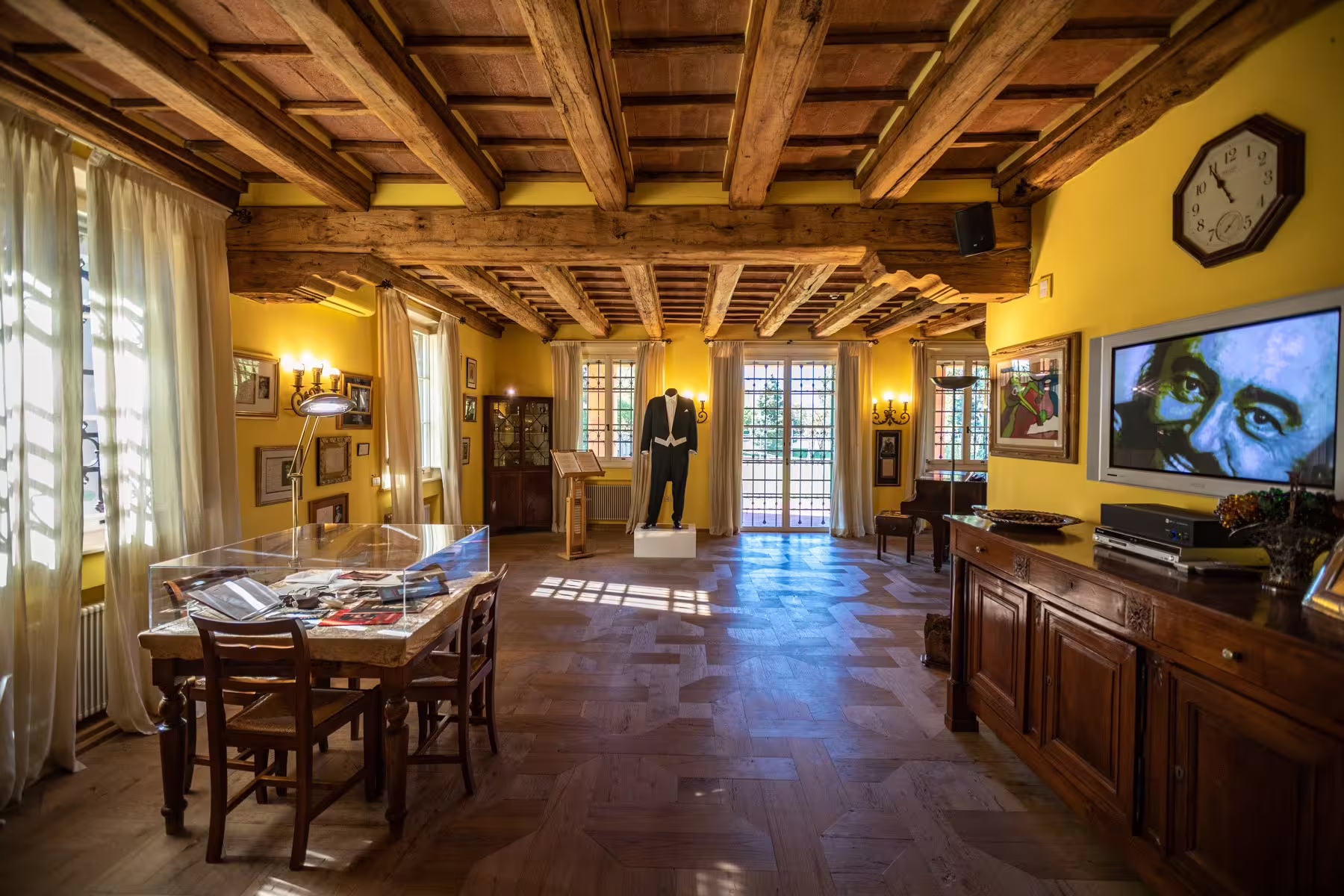 Casa Museo Luciano Pavarotti interior near Modena, with stage suit display included in combo tour