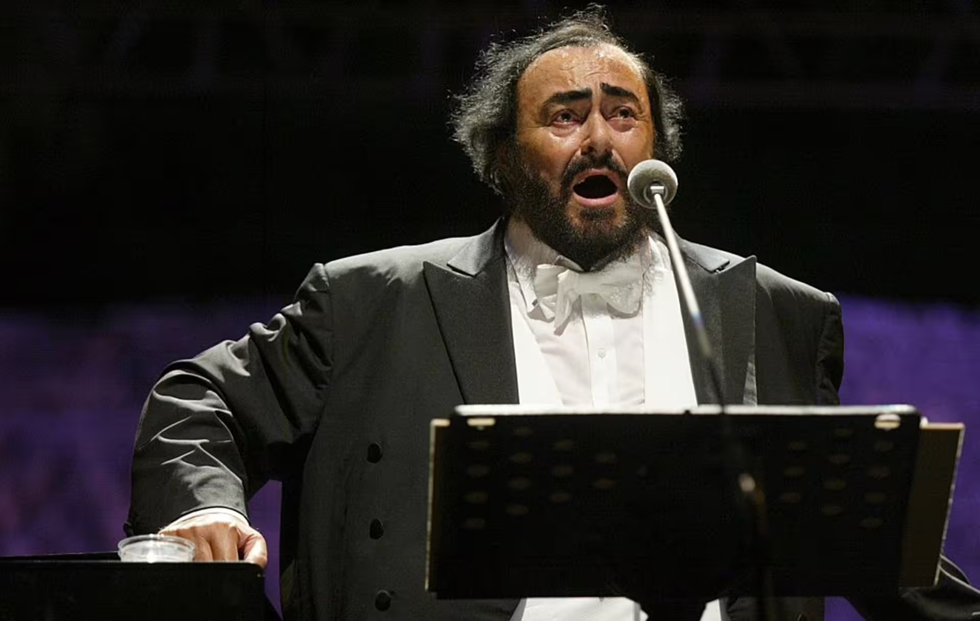 Opera singer performing on stage, image featured in Modena Luciano Pavarotti House Museum entrance ticket tour